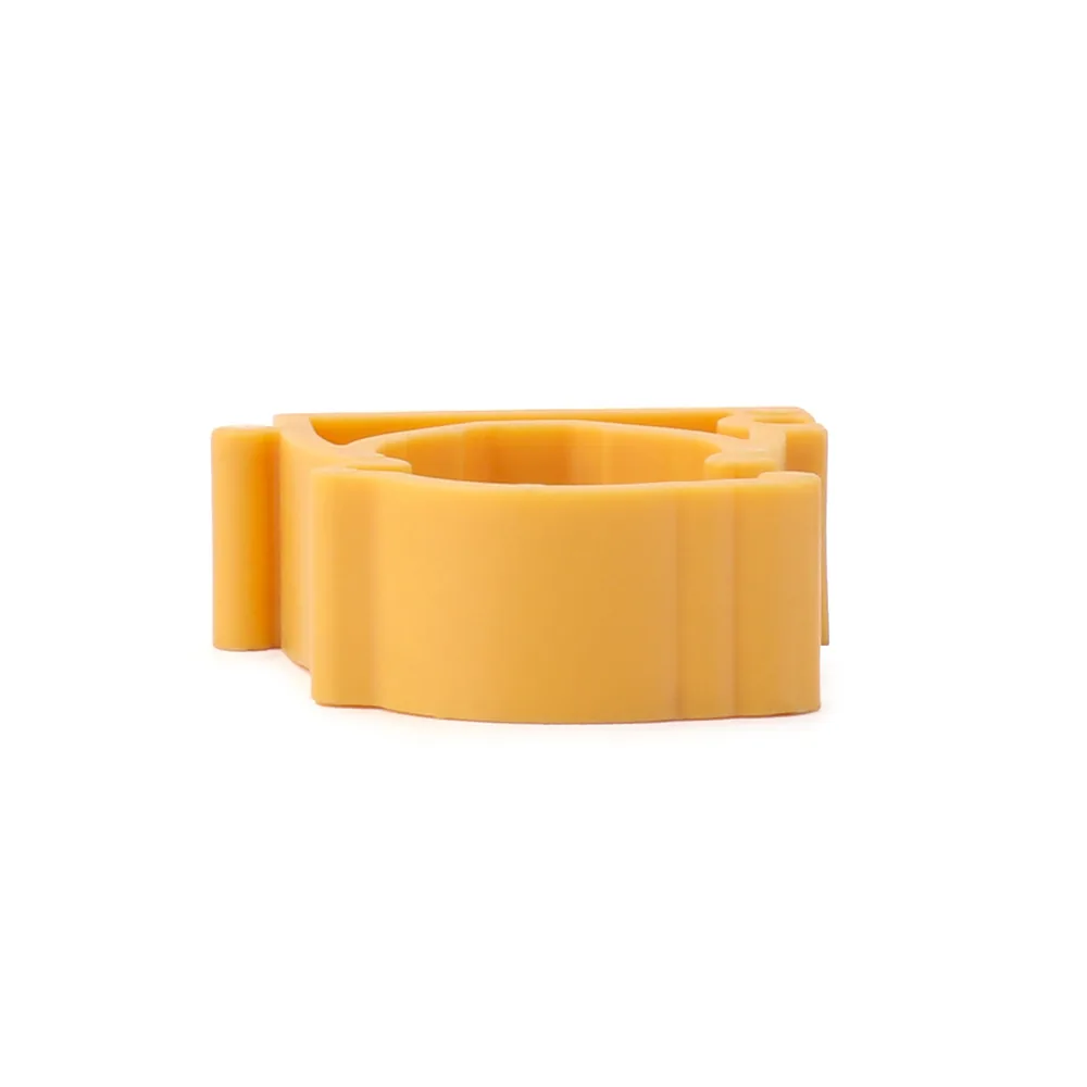 Yellow PPR pipe clamp lying flat