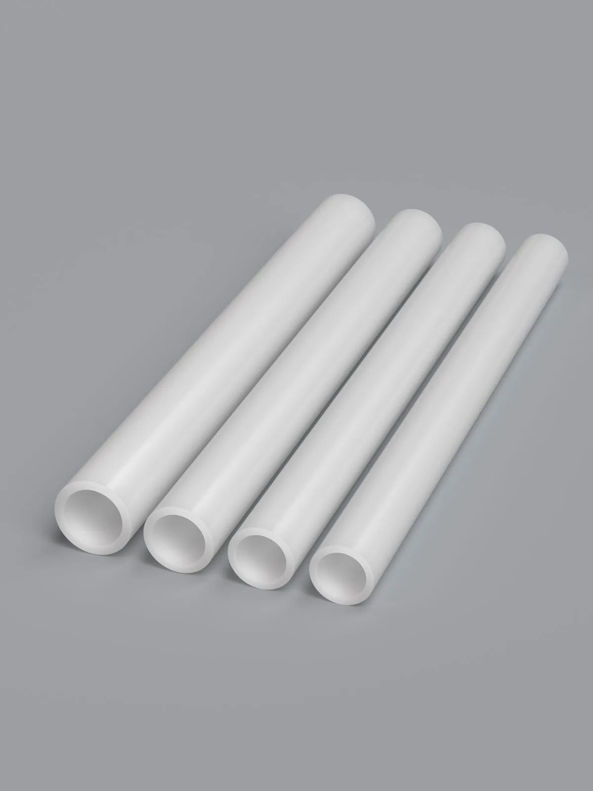 Cut ends of PEX heating pipe lined up by size showing wall thickness and bore across the range