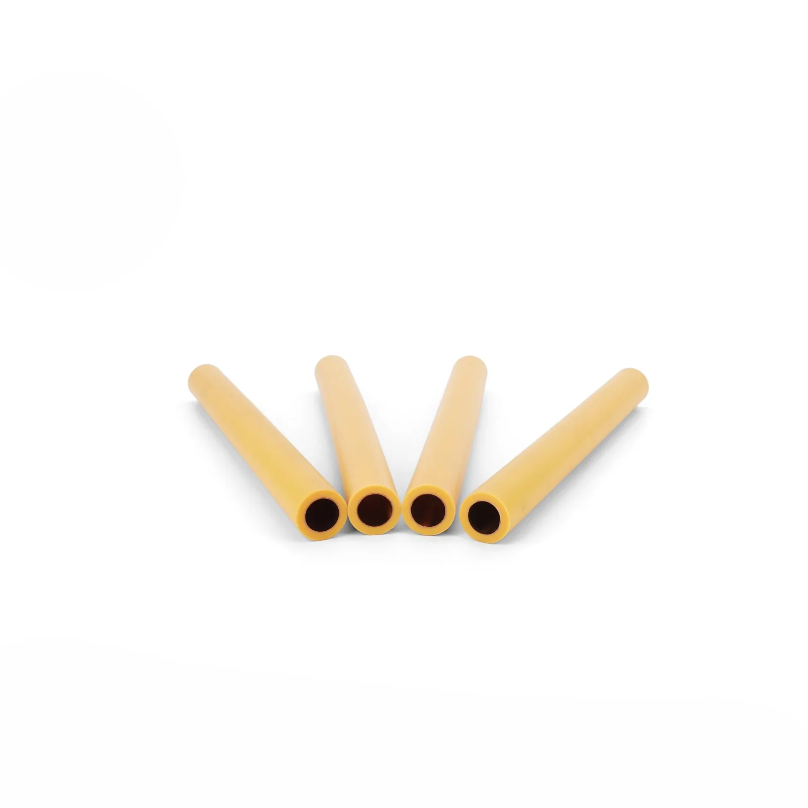 Cut ends of Hitze PPR-CU pipe showing the bright copper bore inside the yellow PP-R wall next to standard PP-R and multilayer samples