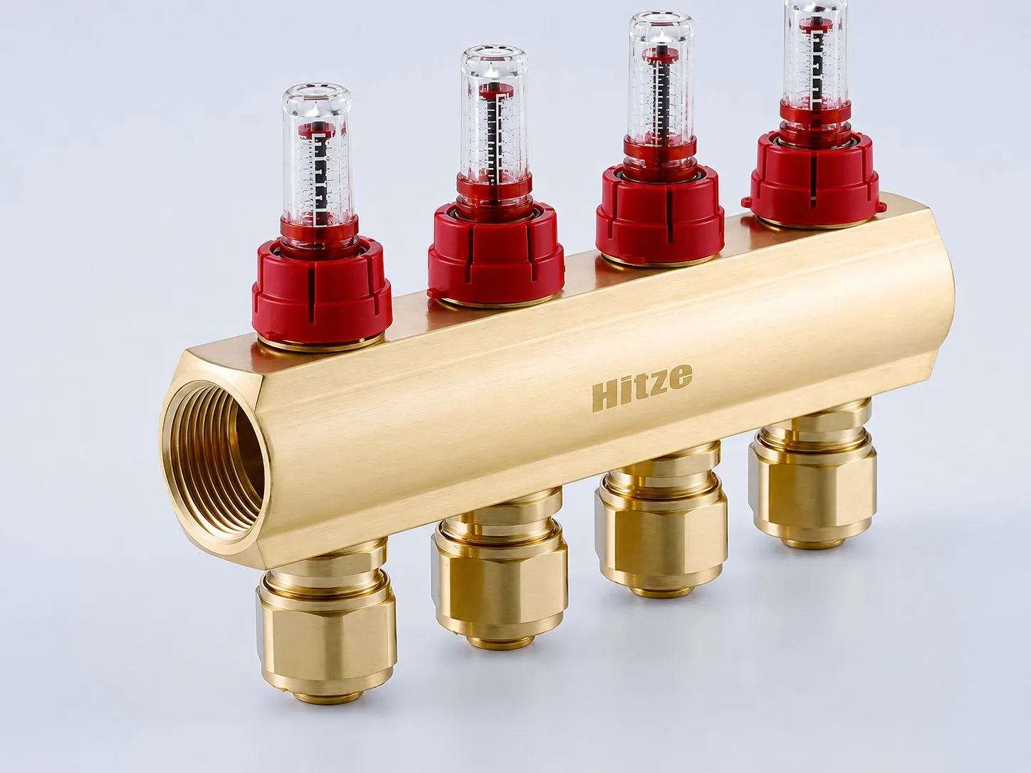 Manifold flow bar with clear sight-gauge flow meters and loop outlet connections, close-up