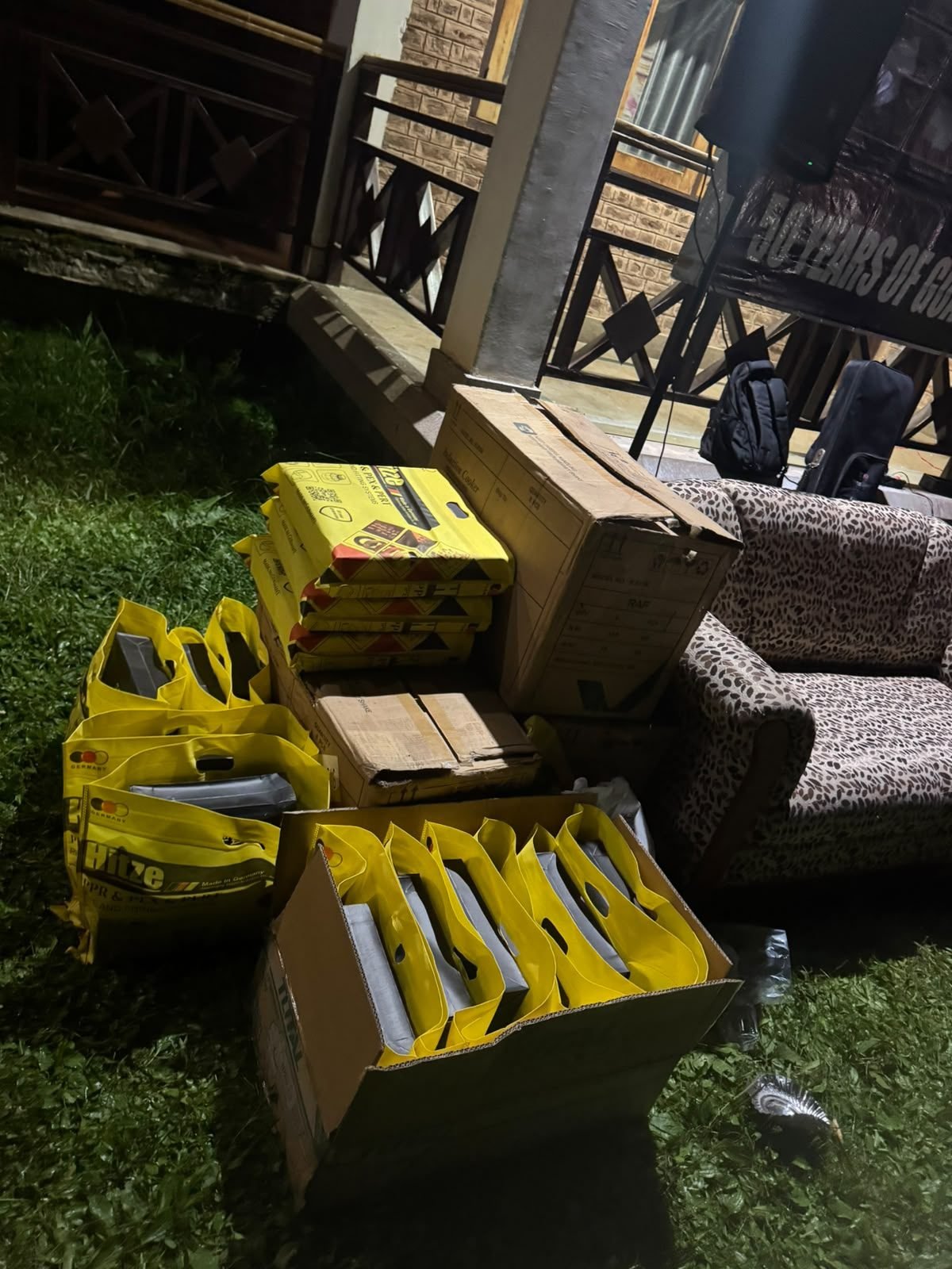 Boxes of yellow Hitze gift bags ready for plumbers